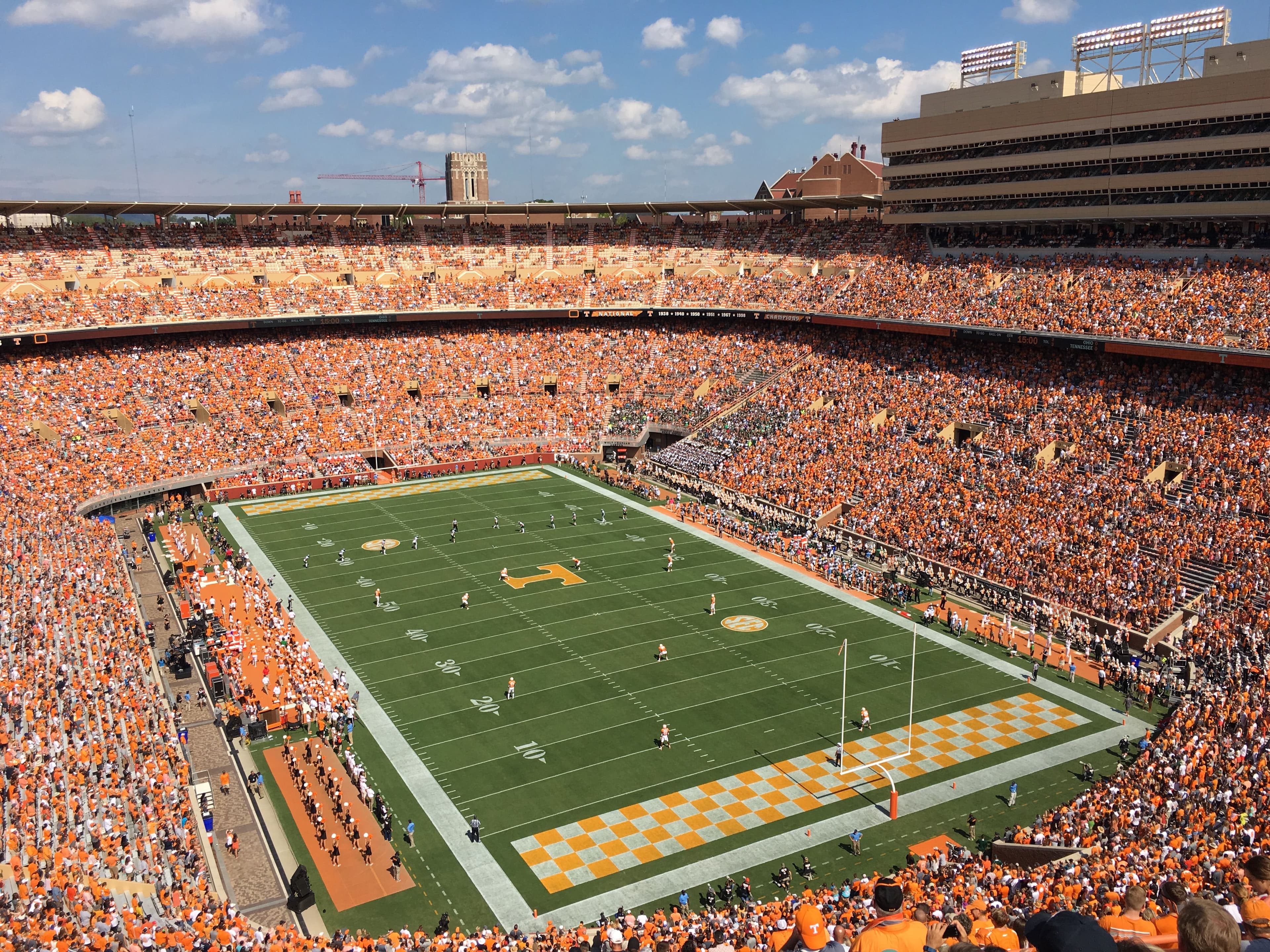 Packed college football stadium viewed from above on game day