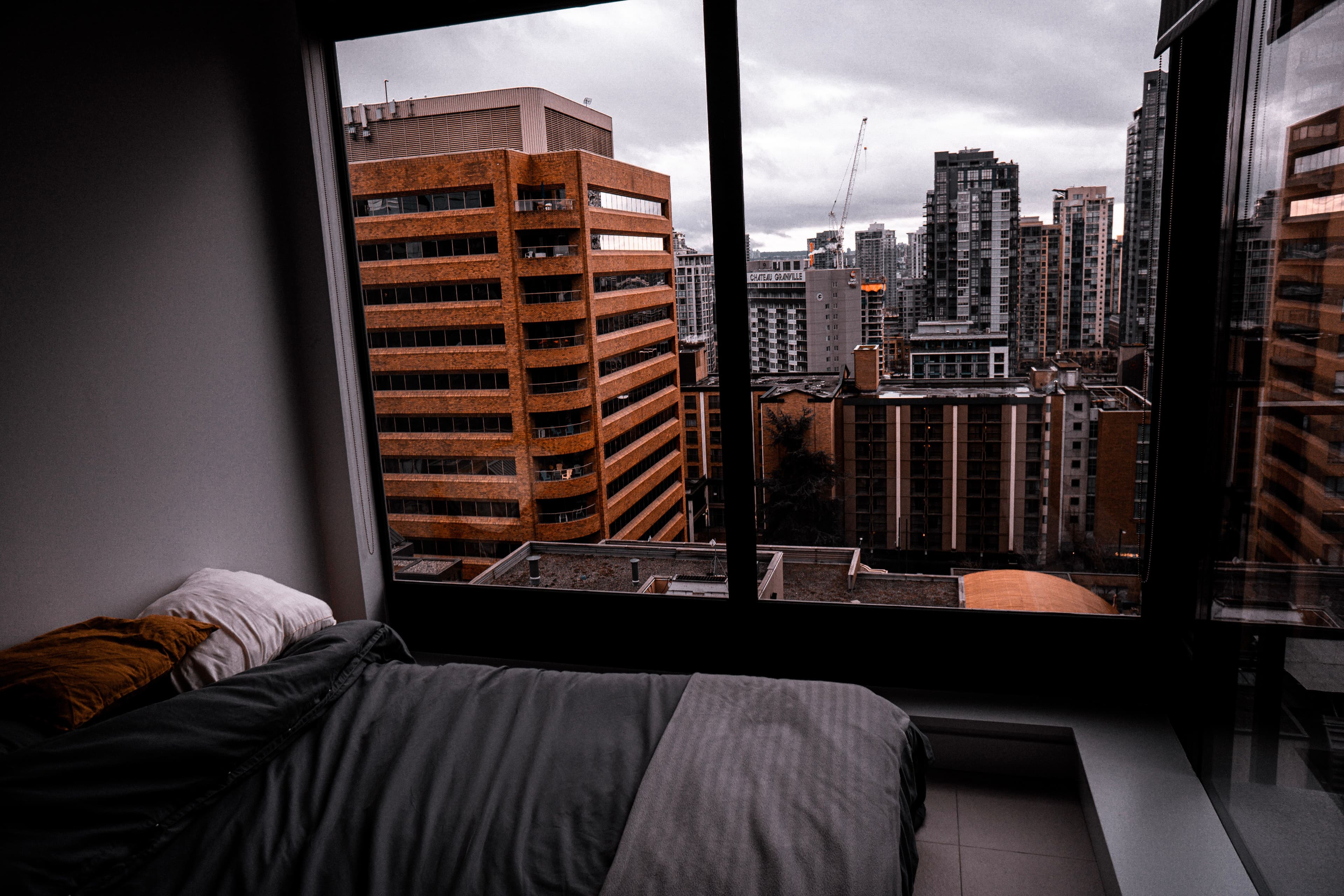 Apartment balcony overlooking a city skyline at night