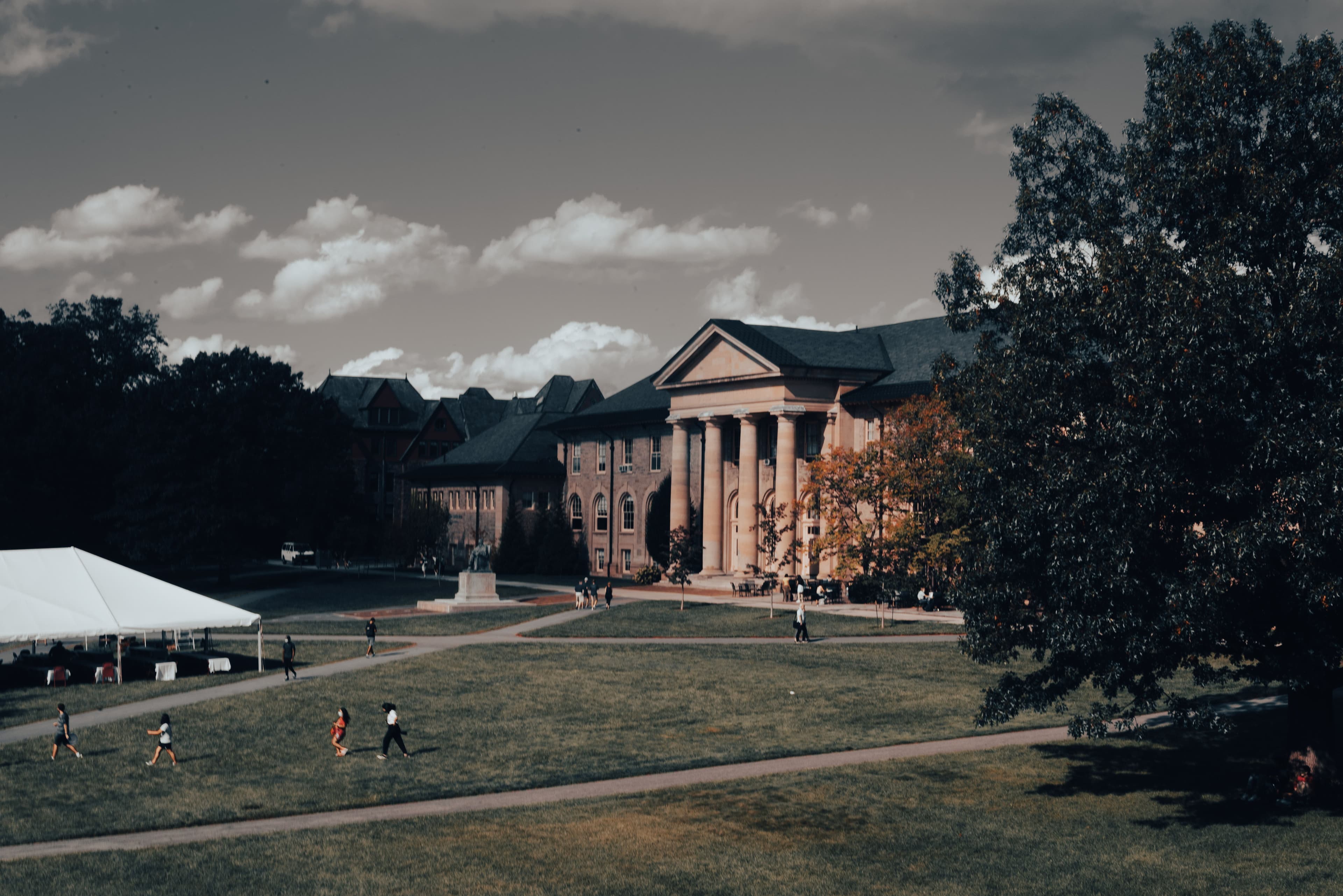 Brick institutional academic building with tall windows