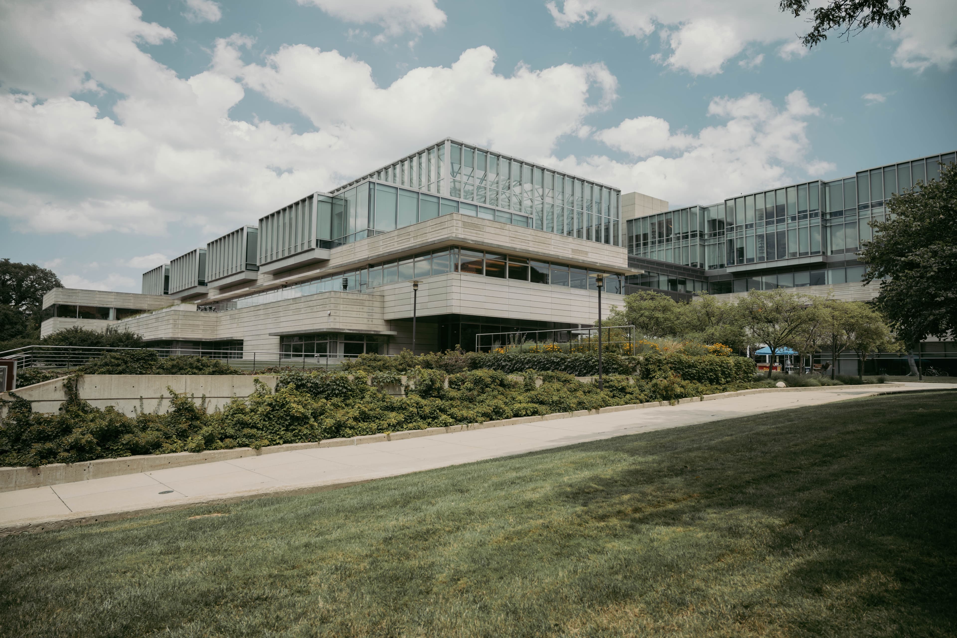 Modern glass academic building on a tech-forward campus
