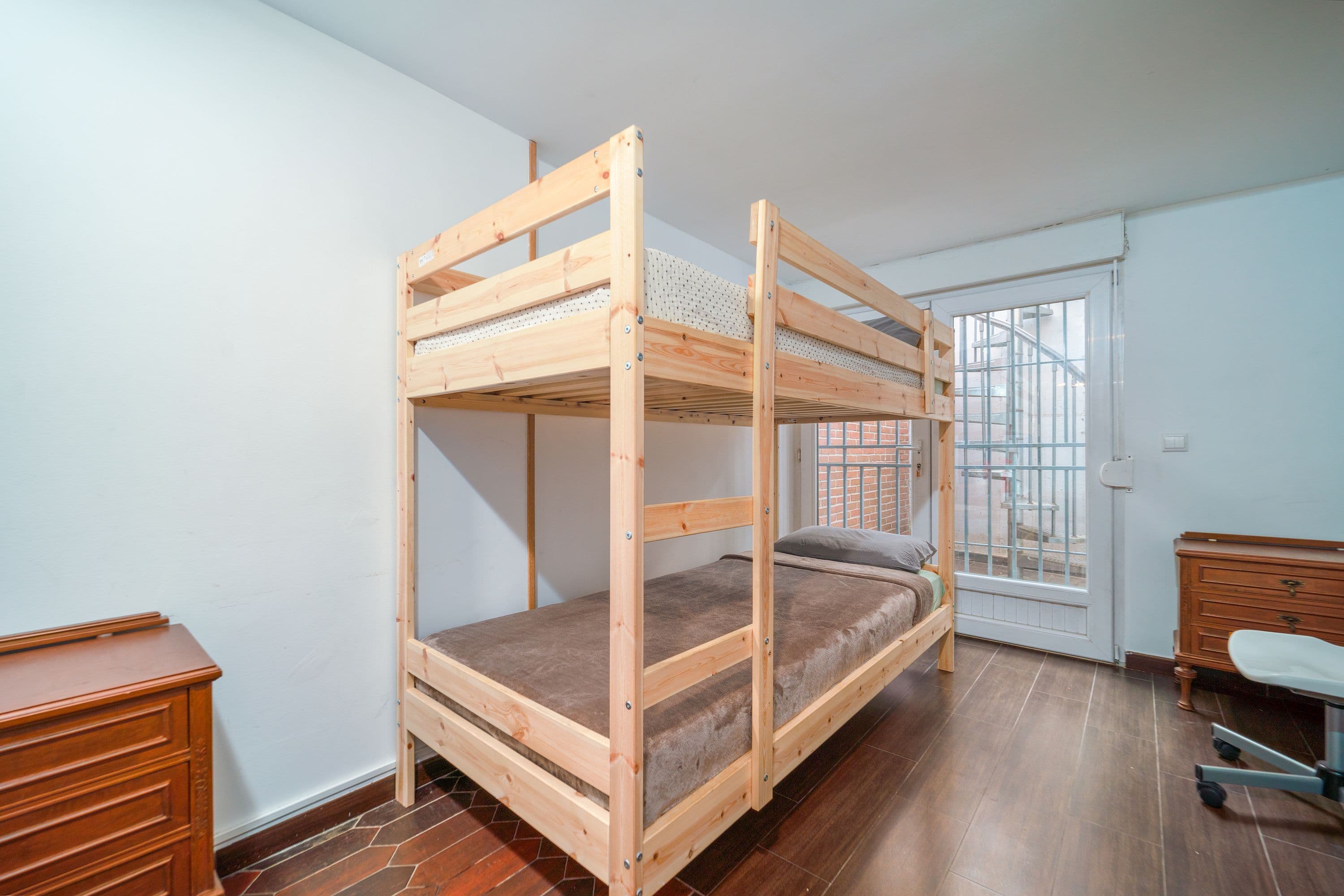 Bunk-style twin XL beds in a shared dorm room
